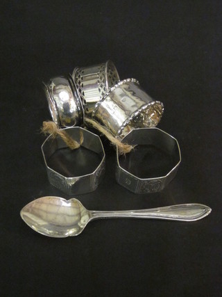5 various silver napkin rings and a silver jam spoon, 2 ozs