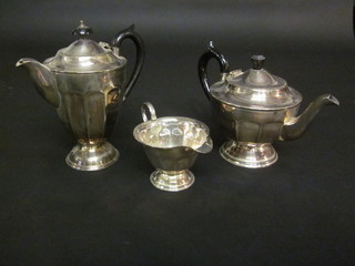 A circular silver plated 3 piece tea service comprising teapot,  milk jug and hotwater jug