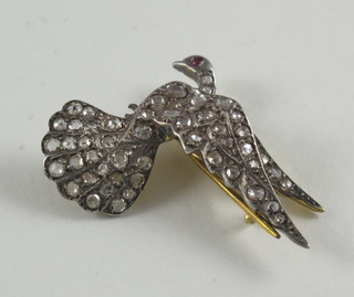 A brooch in the form of a dove, set diamonds and rubies