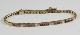 A 9ct gold box link bracelet set baguette cut rubies and diamonds