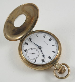 A demi-hunter pocket watch contained in a gold plated case