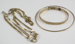 2 gilt metal bangles together with a gilt metal chain