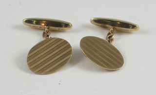 A pair of 9ct gold oval cufflinks