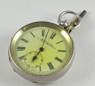 An open faced pocket watch by H Samuel contained in a silver open case