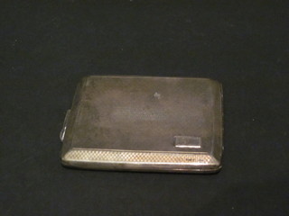 A silver cigarette case with engine turned decoration Chester 1938, 3 1/2 ozs