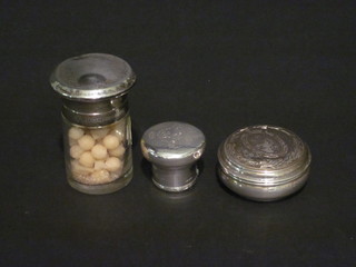 A cylindrical cut glass salts bottle with silver lid, Birmingham  1916, a modern cylindrical jar and cover 1" and a silver dressing  table bottle lid