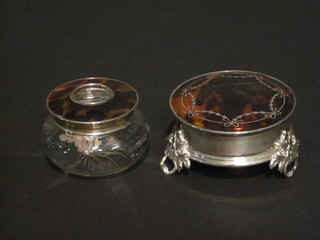 A circular silver and tortoiseshell trinket box, raised on pierced panel supports, Birmingham 1909, 3 1/2"