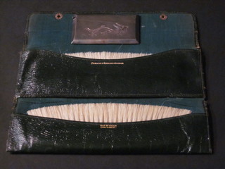 An Eastern white metal card case decorated a dragon 3 1/2"  together with 2 ivory handled clothes brushes