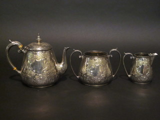 A circular embossed silver plated 3 piece tea service comprising teapot, twin handled sugar bowl and cream jug