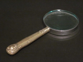 A magnifying glass with silver handle, London 1928