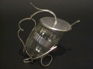 A glass and silver plated preserve jar