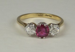 A lady's 18ct gold dress/engagement ring set a ruby and  2 diamonds