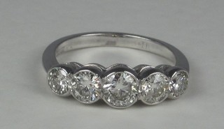 A lady's 18ct white gold dress/engagement ring set 5 diamonds,  approx 1.50ct