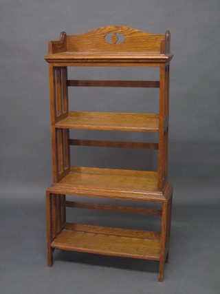 An oak aesthetic movement 4 tier bookcase with raised pierced back 24"
