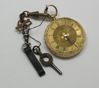 An open faced fob watch contained in an 18ct chased gold case