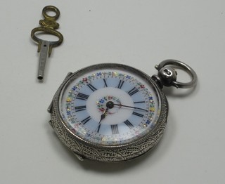 An open faced fob watch contained in a chased silver case