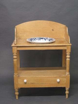 A 19th Century stripped and polished pine wash stand with three-quarter gallery, the base fitted a drawer, raised on turned  supports, complete with a blue and white wash bowl, bowl f, 28"
