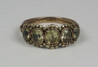 A 19th Century gilt metal ring set 5 oval amber coloured stones