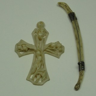 A pierced and carved ivory cross together with an ivory brooch