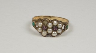 A 19th Century gold ring set pearls and emeralds