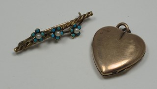 A gilt metal heart shaped locket, a gilt metal bar brooch