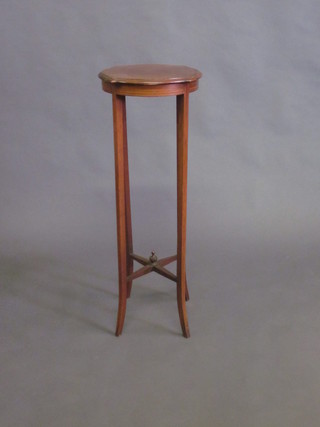 A circular Edwardian mahogany jardiniere stand, raised on tapered supports with X framed stretcher 14"