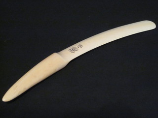 An Edwardian ivory newspaper opener with armorial decoration  17"