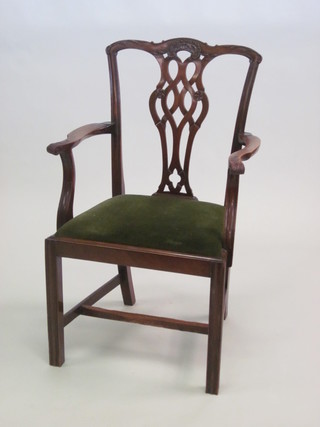 A Chippendale style open arm carver chair with upholstered drop  in seat, raised on square tapering supports