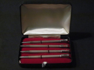 4 silver and enamelled propelling pencils/bridge markers