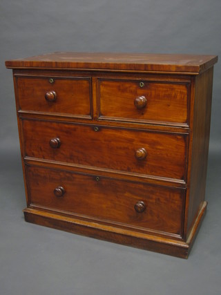 A Victorian mahogany chest of 2 short and 2 long drawers,  raised on a platform base 40"