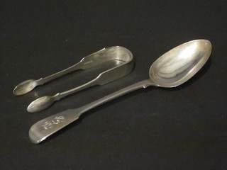 A pair of antique silver fiddle pattern sugar tongs Newcastle together with a Victorian silver fiddle pattern table spoon,  London 1851, 3 ozs