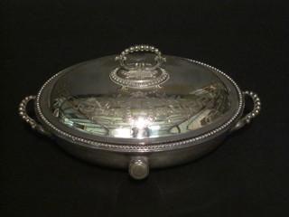 An oval engraved silver plated twin handled entree dish and  cover