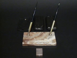 A silver plated Dupont lighter together with an onyx desk pen set  and 2 leather cigar cases