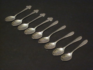 5 silver coffee spoons and 4 silver teaspoons with golf emblems,  3 1/2 ozs