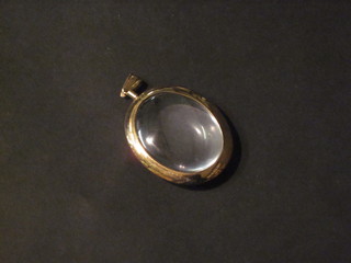 An oval 9ct gold locket