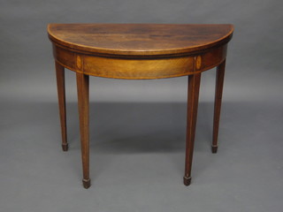 A 19th Century inlaid mahogany demi-lune card table, raised on  square tapering supports 35"  ILLUSTRATED