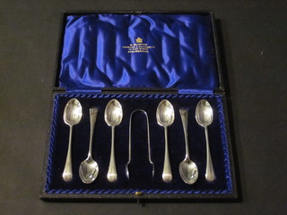 A set of 6 silver coffee spoons together with a pair of sugar  tongs, Sheffield 1909, cased, 3 ozs