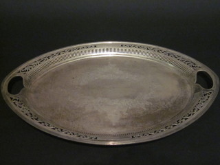 An Edwardian oval engraved and pierced silver twin handled tea tray, Sheffield 1901, 48 ozs