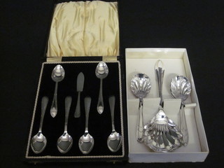 A set of 6 silver plated tea spoons together with a butter knife,  cased and a set of 6 chromium plated fruit spoons with server,  cased