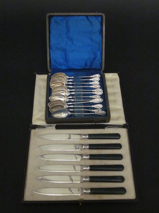 A set of 12 Continental coffee spoons and a set of 6 tea knives,  cased