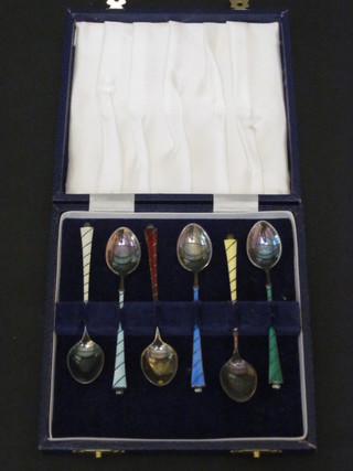 A set of 6 Sterling silver and enamelled coffee spoons cased