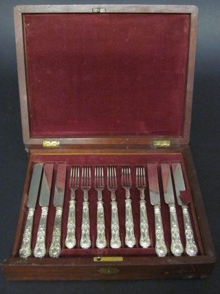 A set of 12 Victorian silver plated fruit knives and forks, 1 fork f, contained in a mahogany canteen box