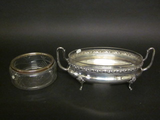 An oval twin handled silver plated dish frame with cut glass bowl  14" and a circular cut glass bowl 7 1/2"