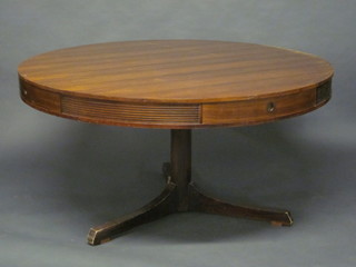 A 20th Century circular rosewood drum table, fitted 4 drawers, raised on a turned column 56"