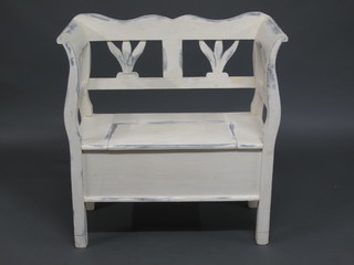 A white painted pine settle with pierced back 33"