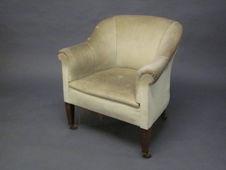 An Edwardian mahogany tub back chair upholstered in cream material