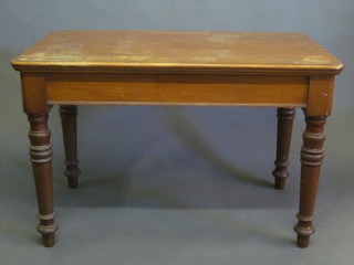 A rectangular Victorian mahogany library table, raised on turned supports 48"
