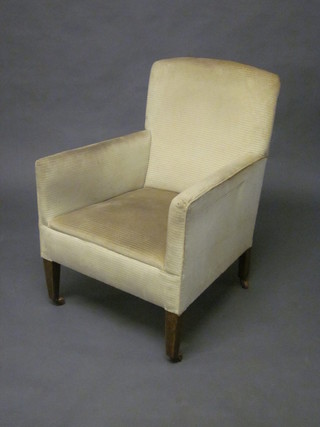 A Victorian mahogany armchair upholstered in cream striped  material