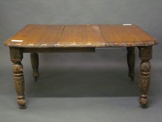 A Victorian carved oak extending dining table raised on turned  and carved supports 38", af,
