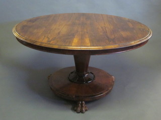 A Victorian circular mahogany breakfast table, raised on a chamfered column and paw feet 48"